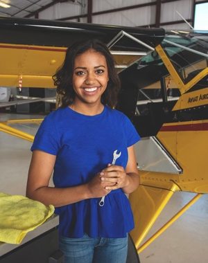 Girl next to an airplane